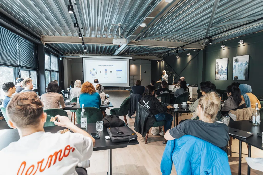 People attending a small workshop presentation